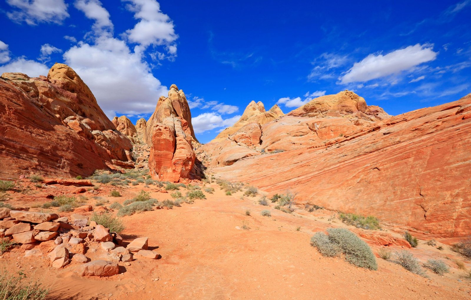 A Clear Blue Sky With Fluffy White Clouds Above The Slot Canyons Near Las Vegas